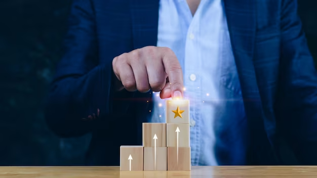 Man in suit touching wooden cube stairs with golden star.