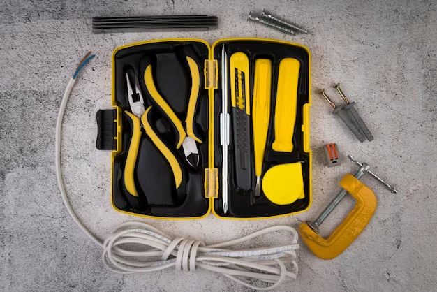 Open toolbox with tools scattered around.