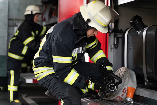 Firefighter inspecting gear