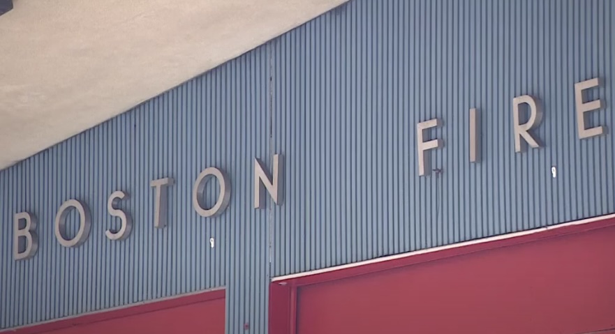 Sign on building wall with the words 'Boston Fire